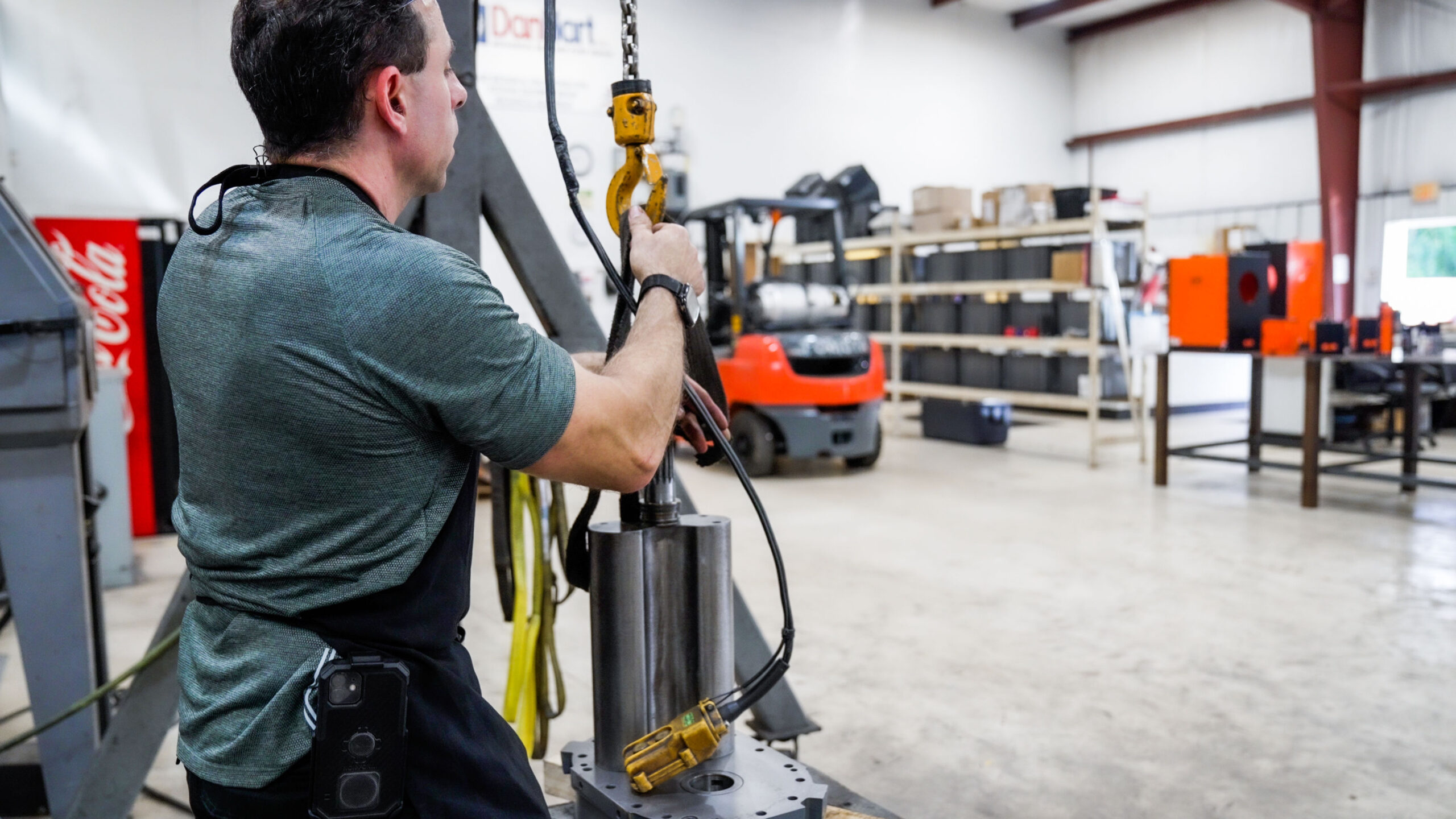 A man working on vacuum pump and blower repair for DanHart, LLC.