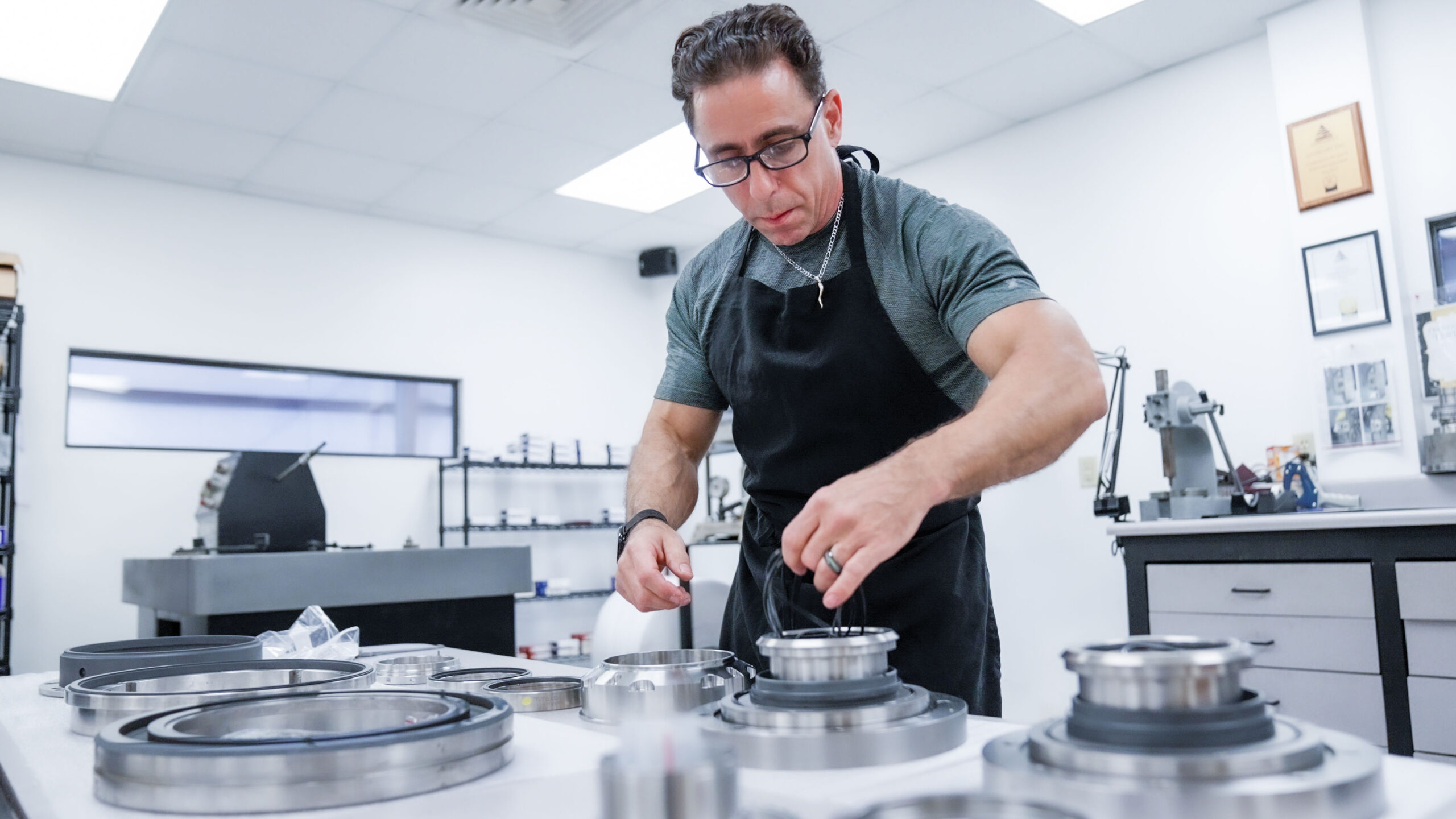 A man working on vacuum pump and blower repair for DanHart, LLC.